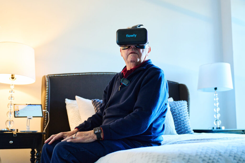 Asbury resident trying Flowly (one of AgeTech Collaborative from AARP's portfolio startups) - photo credit Noah Willman