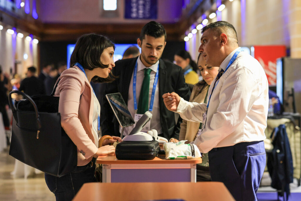 Attendees interacting at the expo floor during MedTech Malta 2024