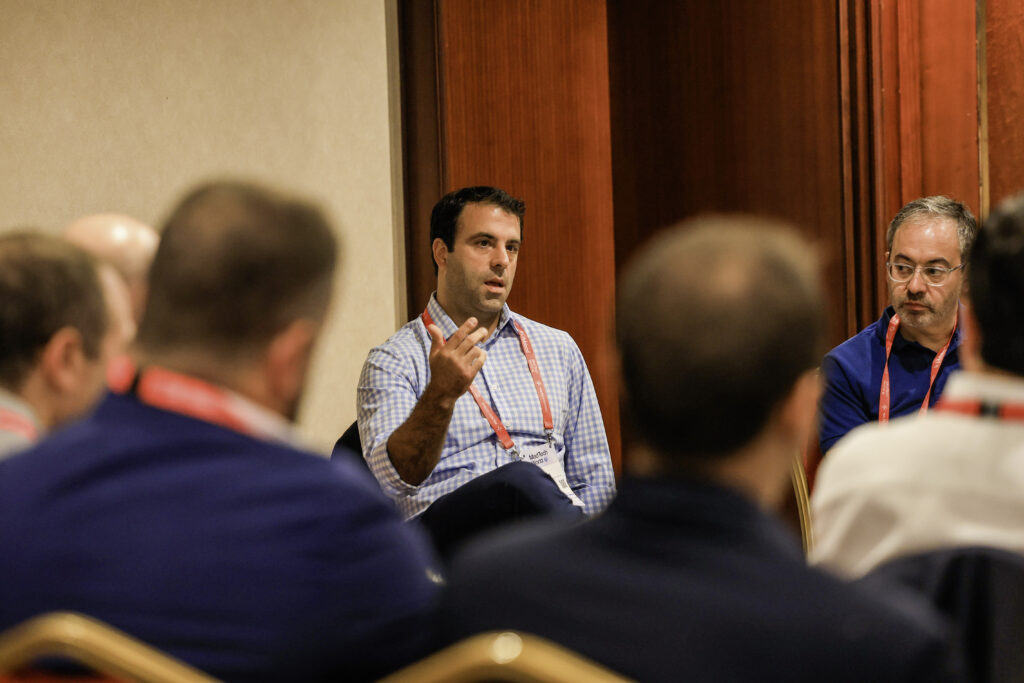 Attendees engaging in discussion during a forum at MedTech Malta 2024