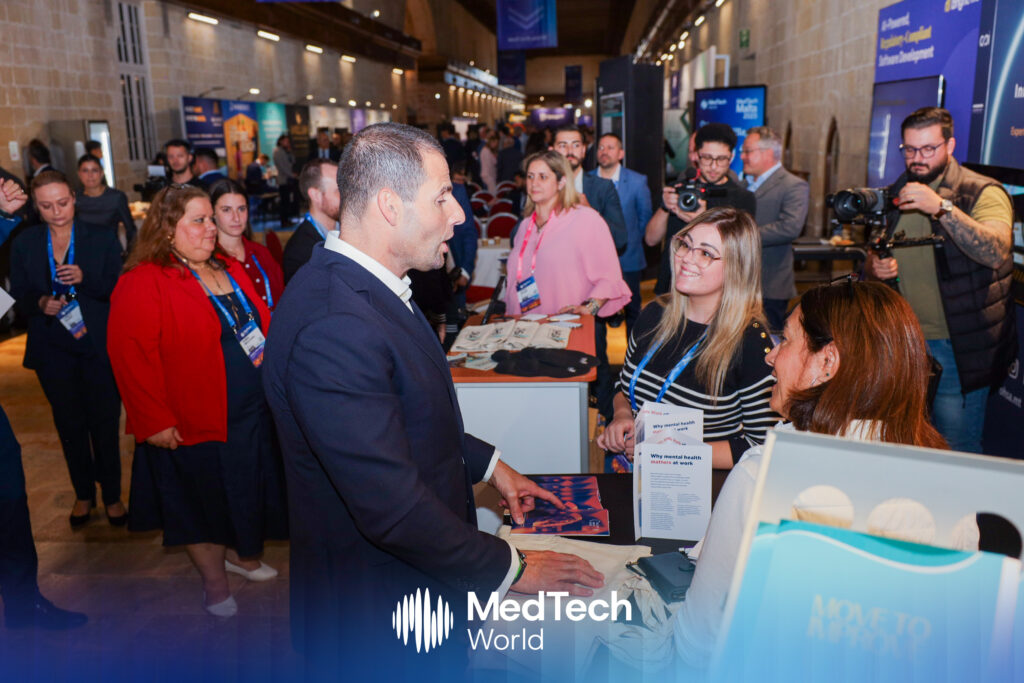 Photo taken from the exhibition floor at MedTech Malta 2025 showing Hon. Robert Abela, Prime Minister of Malta, interacting with the exhibitors
